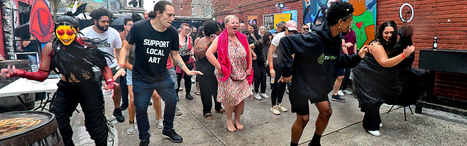 Rain did not stop the audience from joining artists in the Crowbar courtyard and trying new dance steps to the beat of Bomba Body Dance and Drum.
