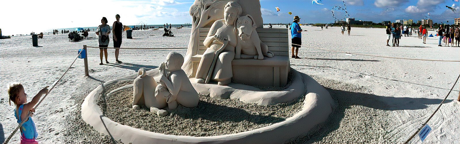 Chapters of life from childhood to old age are depicted in “Doggone Dog Days” by Morgan Rudluff, a sand sculptor and massage therapist from Oakland, CA.
