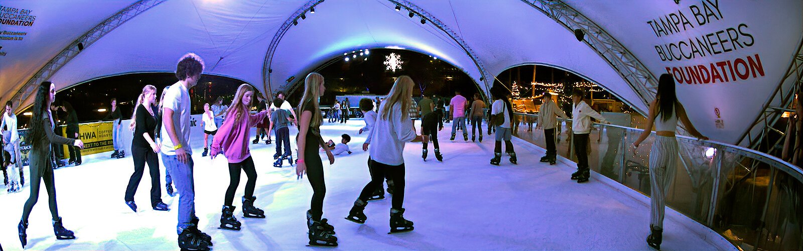 People skate into the holiday season at the Winter Village at Curtis Hixon Waterfront Park in downtown Tampa.