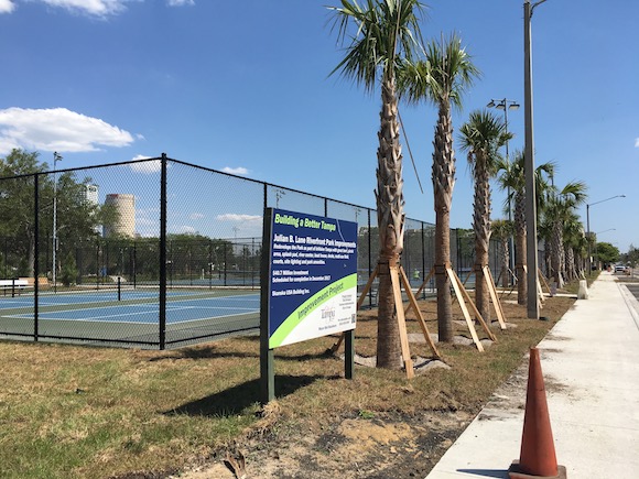 New trees and tennis courts are part of new Julian B. Lane Park on North Boulevard.