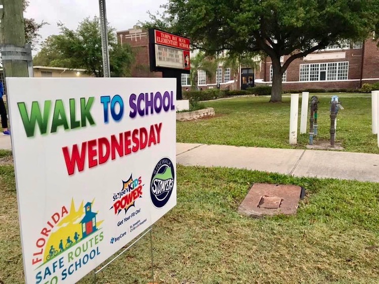 Signage outside Tampa Bay Boulevard Elementary recognizing Walk to School Wednesdays.