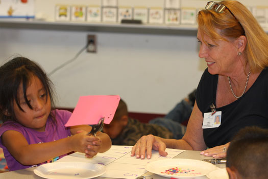 Kindergarten supervisor Lisa Black works with a VPK student.