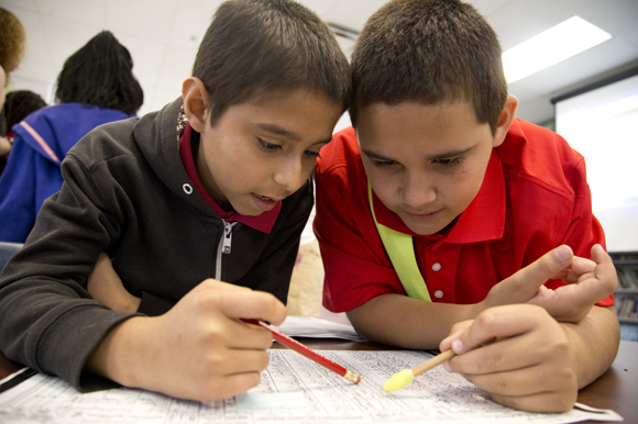 Cerbando Mondragon and Ceejay Liberatore work with their census info. - Julie Branaman 