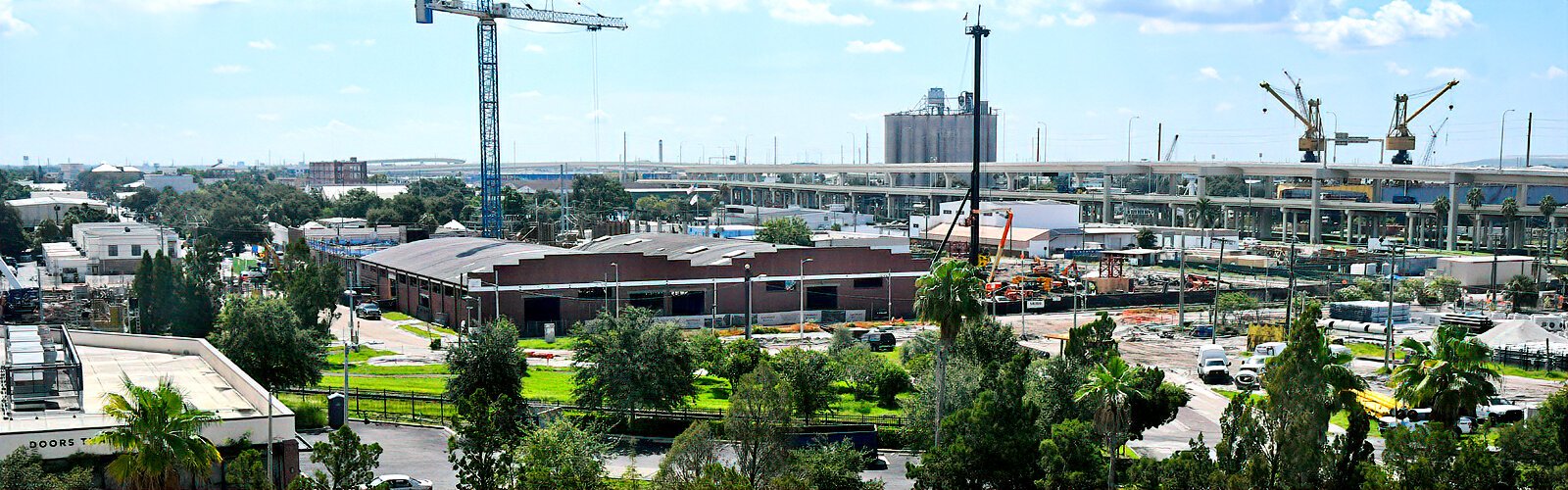 The view looking down on the Gasworx district construction site from the top floor terrace of La Unión apartments on Nuccio Parkway, which earned the distinction of being Gasworx's first completed project when it opened in late 2024. 