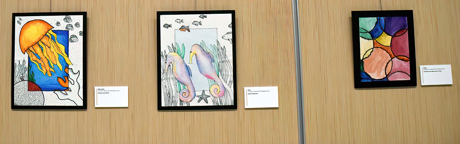  “Atlantic Sea Nettle” by 7th grader Meredith, “Swirly Seahorses” by 7th grader Ivey, and a watercolor painting by kindergartner Olivia are some of the artwork by Roland Park K-8 students showcased in the exhibit