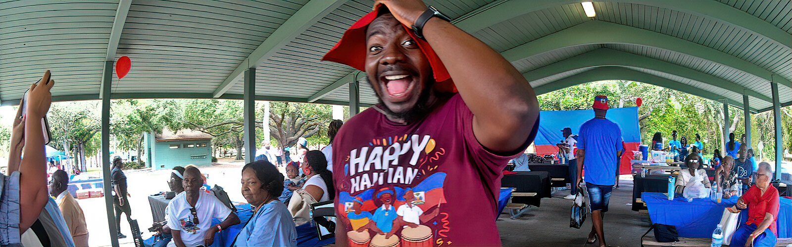 Exuding great energy, emcee Ralphe Jean-Poix keeps the festival audience engaged with contests on Haitian history and culture.