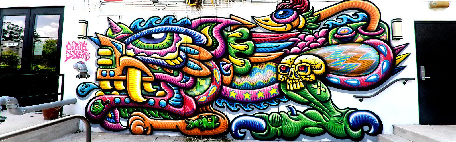 Peruvian-Canadian artist Chris Dyer’s spray paint style is recognizable in his Guava Jam mural at Avenue Lofts in Seminole Heights.