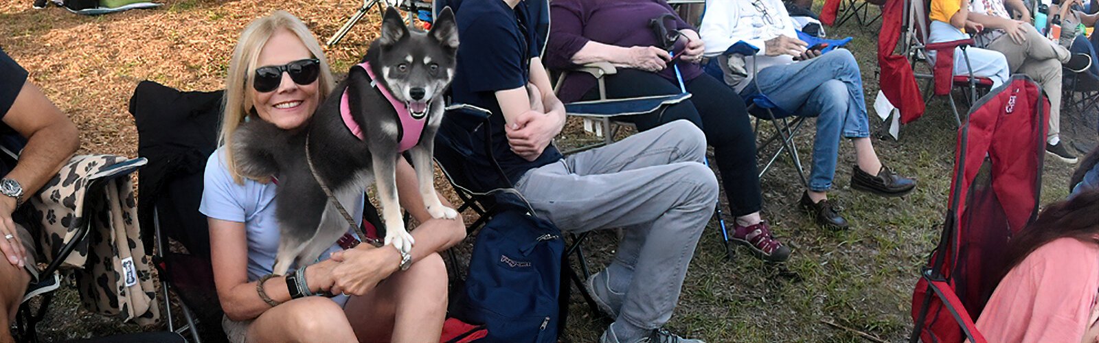 Susan Cano and her 3-year-old pomsky Nikita are ready for an exciting evening in the park with The Florida Orchestra.