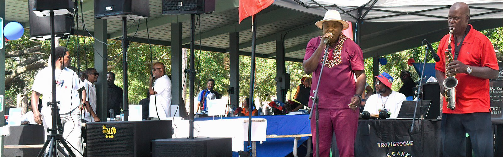 Frantz Dimanche and Yves Morency, with saxophone, entertain the crowd with popular Haitian dance music.