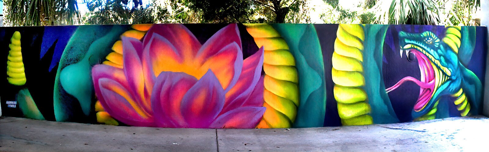 Artist Hannah Lorra’s contribution to the Guava City Paint Jam is this vibrant soul flower snake mashup in Seminole Heights.