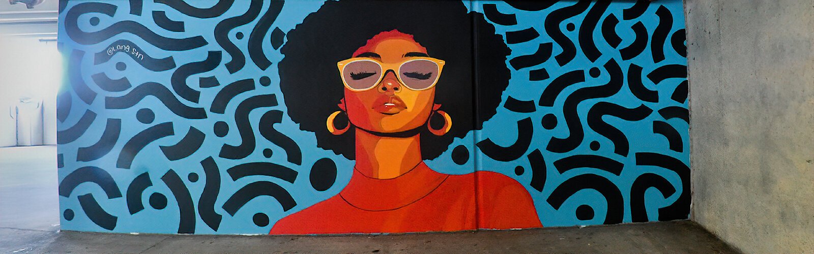  Tampa-based artist Melvin “LANGSTN” Halsey Jr.’s love for African culture is reflected in his mural in the Grassroots Kava House parking garage.