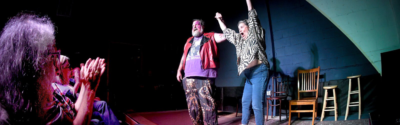 An audience member joins wrestler-comedian Patrick Price on stage at The Commodore to try out an improvisation of her own