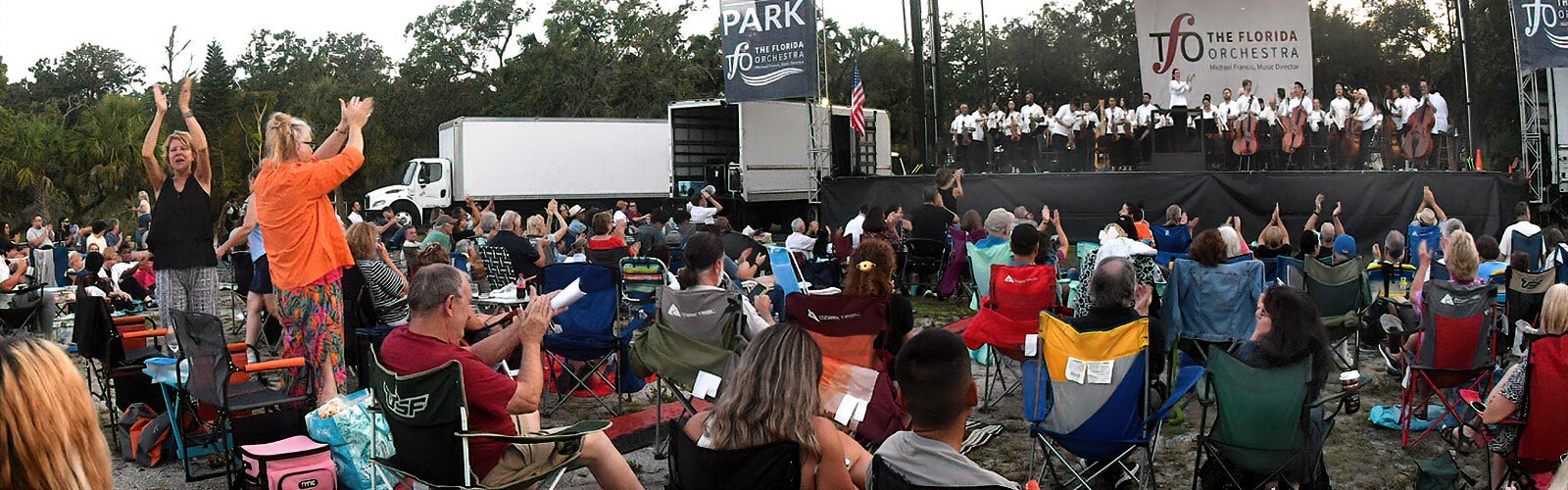 Following the Armed Forces Salute arranged by Bob Lowden, an enthusiastic crowd applauds the veterans attending the Pops in the Park concert.
