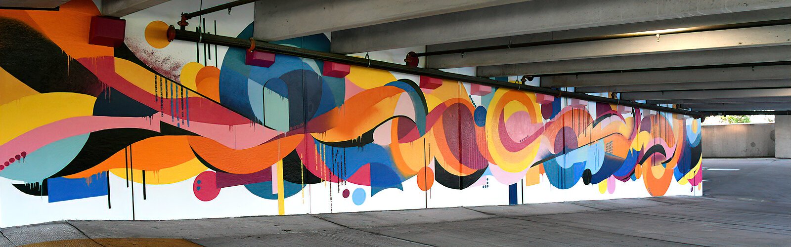 Despite a challenging, roughly textured wall for a canvas, artist Jason Harvin of Wayward Walls created an impressive mural in Grassroots Kava House’s parking garage.