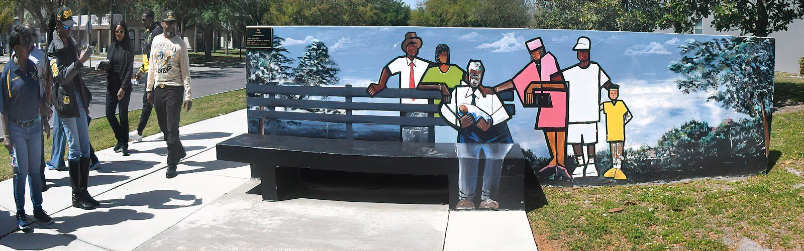 “The Family” is part of artist James Vann’s “Reflections of East Tampa” mural series,  commissioned in 2011 by the East Tampa Aesthetics and Beautification Committee.