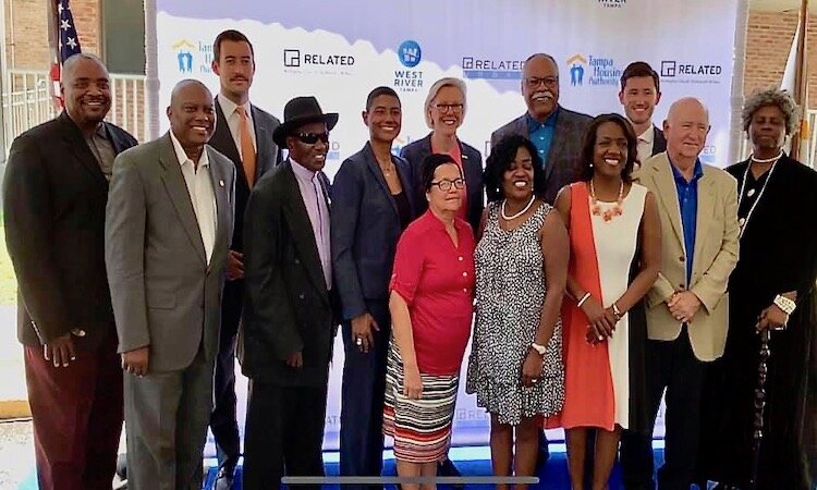 Community dignitaries gather to celebrate the renovation of Mary Bethune apartments.