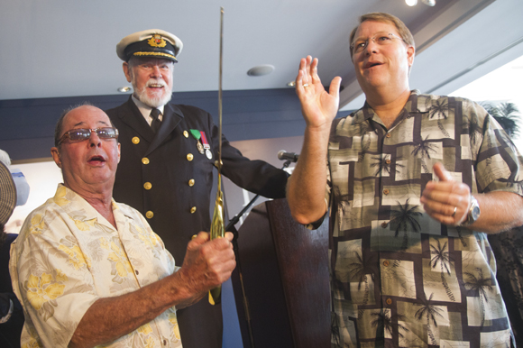 Bill Edwards, Lowell Lytle aka Capt. John Smith and Mayor Baker cheer after cutting the ribbon for t