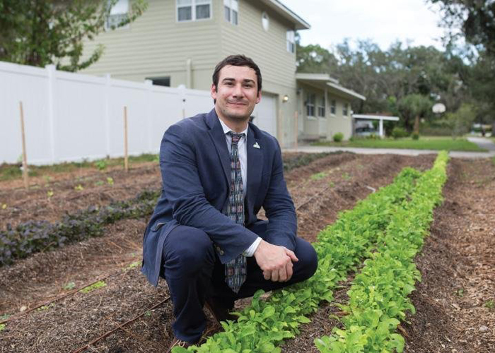 Chris Castro, Dir., of Sustainability & Resilience for the City of Orlando at an urban front-yard farm, part of the Fleet Farming program.
