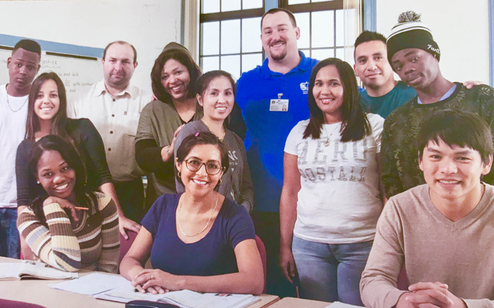 Michael Glenn with students from an advanced ESL class.