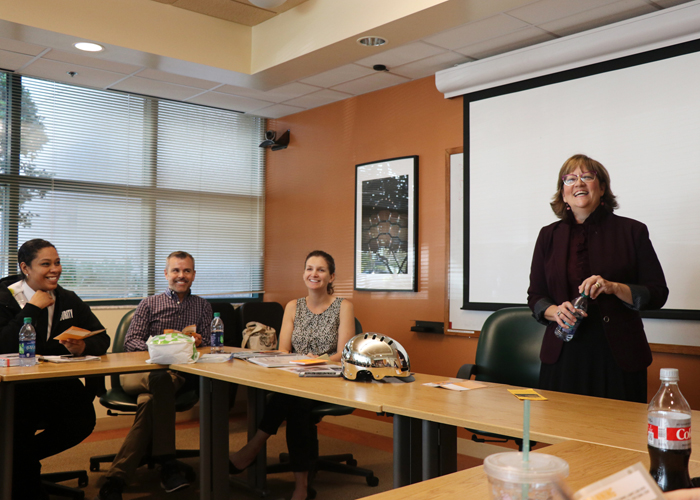 Christine Acosta listens in to Straz Center employees as the Straz Center has committed to becoming a bike-friendly business.