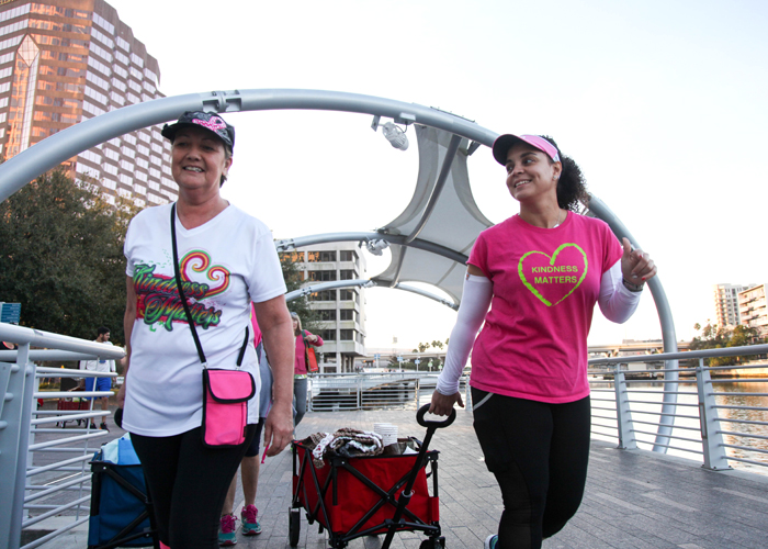 Rosie Abbs, left, and Maribell Figueroa, both breast cancer survivors, volunteer with Kindness Matters to help feed the homeless, as an expression of gratitude and a way to give back.