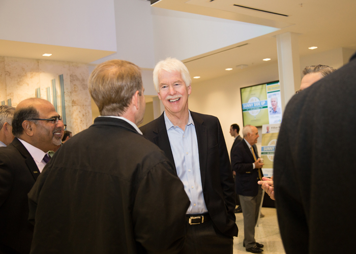 Guest speaker Bill Wallace talks with attendees at the first Sunny Side Up forum.