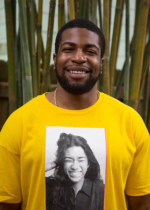 A supporter of art wears a t-shirt with a photo of his girlfriend on it while viewing art in Historic Kenwood.