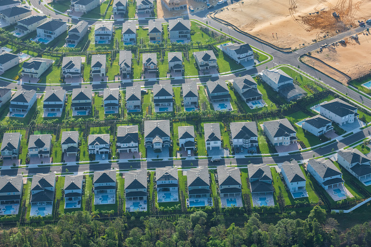 Swimming pools occupy every back yard of newly built homes adjacent to where Reedy Creek crosses Interstate 4.