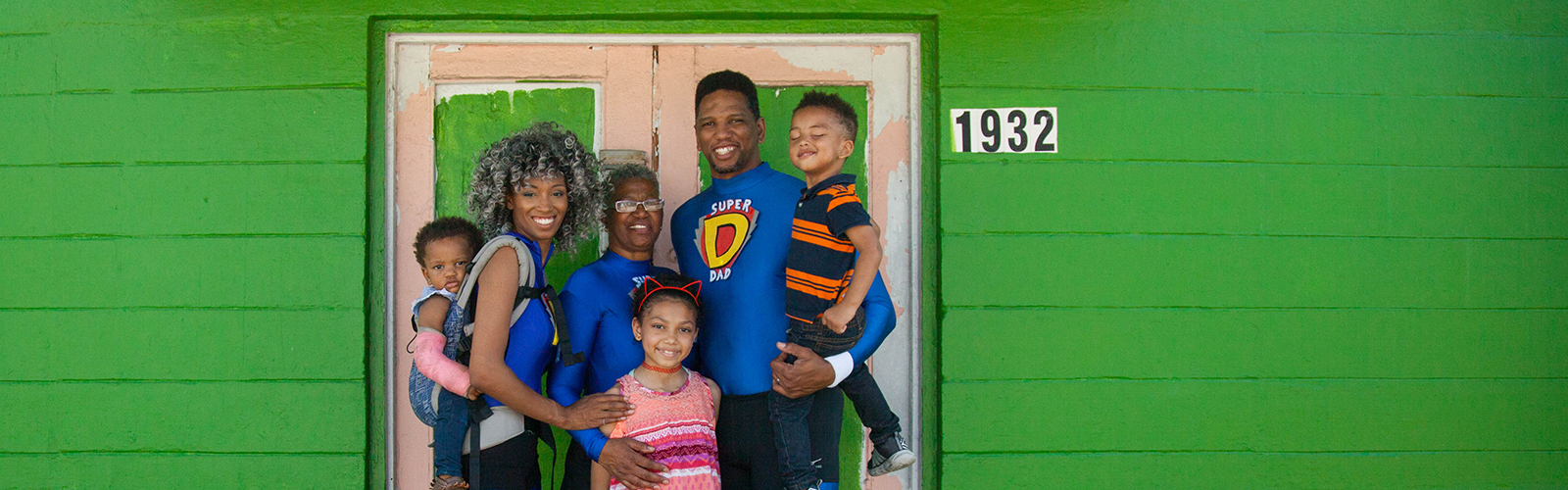 Founders of Joining Together Eliminating Poverty with their kids and grandkids at their future headquarters in West Tampa. 