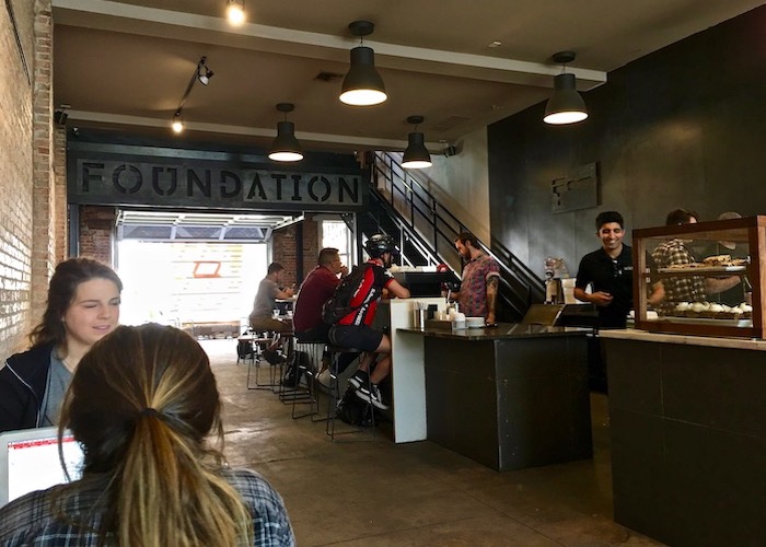 Patrons carve out workspace inside Foundation Coffee Co. on North Franklin in Tampa Heights.