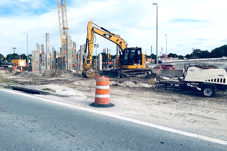 Construction equipment lines Gandy Boulevard for new ramps at Dale Mabry and Gandy in Tampa.