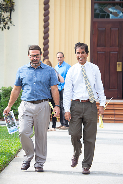 Elvin Martinez, left, and Jacob Kallupura after a Palm Sunday service in West Tampa.