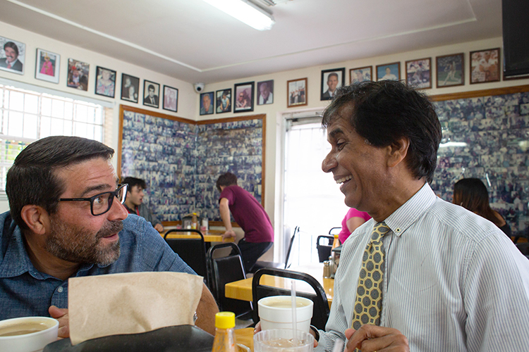 Elvin Martinez, left, talks with Jacob Kallupura, who has been commuting from Boston to Tampa over the past six years. 