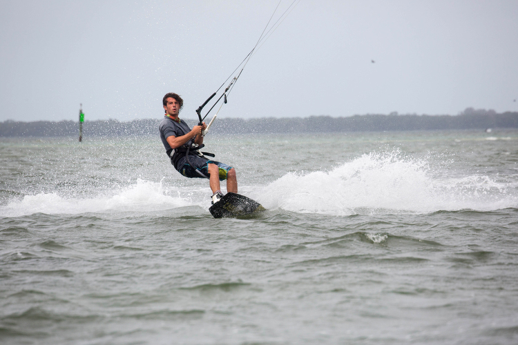 Anthony Franchi, owner and instructor, with Kiteboarding St. Petersburg surfs near the Skyway.