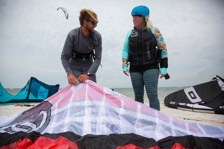 Dave Tichman and Barb Draves prepare to head out in 26 mph winds for kiteboarding lessons.