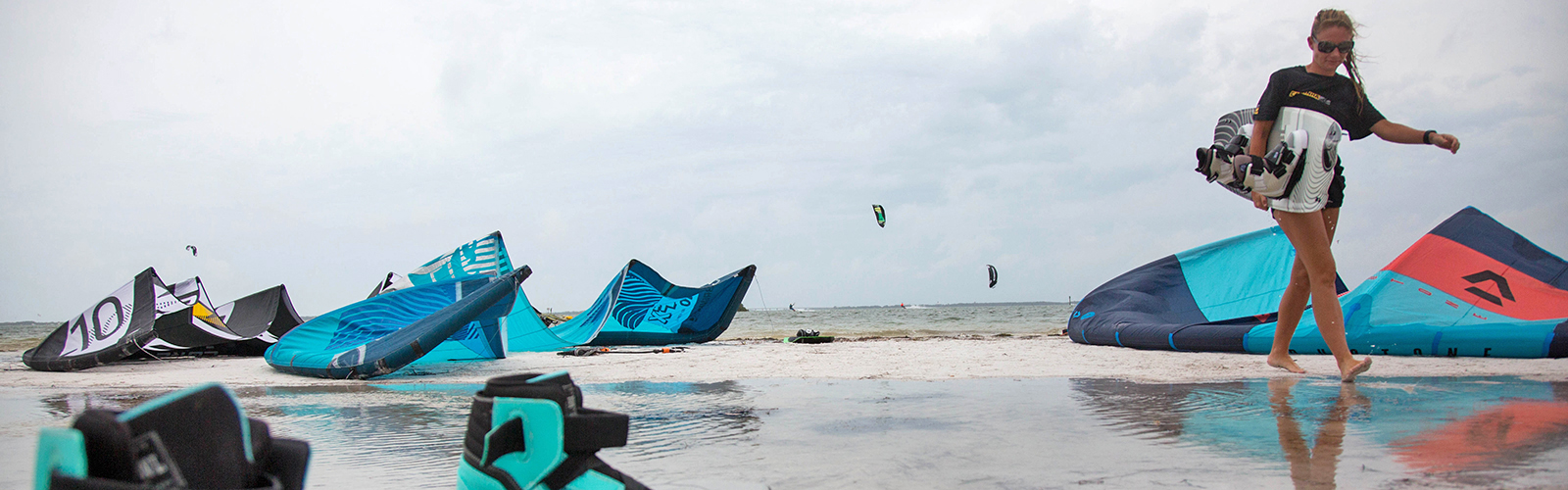 Rebecca Wilcox walks along shore in between kiteboard sessions at Skyway Bridge West.