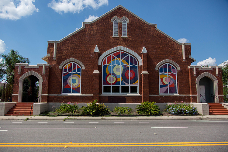 Mural art by Angela Cannata and students adorn the windows of the Tampa Heights Youth Development and Community Center.