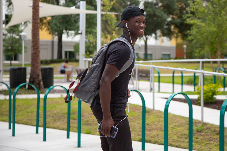 A student skates past while heading to class at USF.