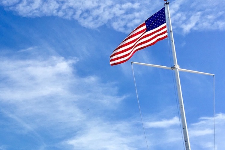 The American flag, a global symbol of freedom and independence, protected by American military veterans stationed around the globe.