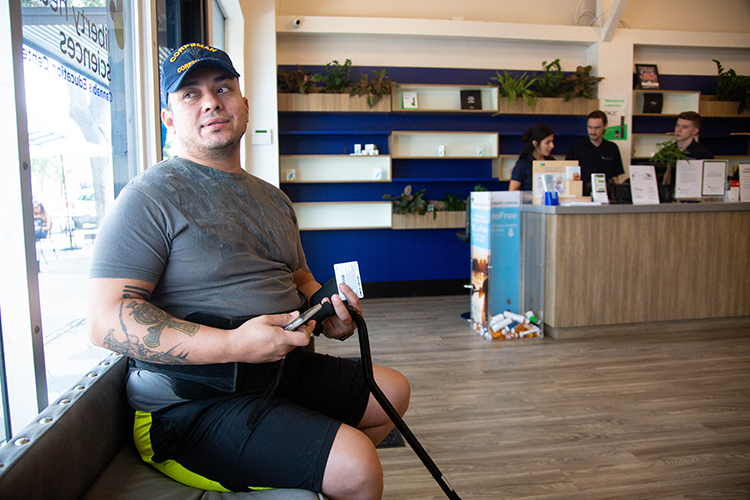 Eduardo Amezquita, a retired veteran, waits for his medicinal marijuana prescription for his 11th back surgery, which he says helps minimize his need for prescription opiates. 