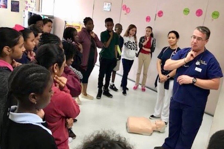 Students learn how to check their pulse at the Technical Healthcare Forum, a partnership with the Council for Educational Change and Hillsborough County Public Schools. 