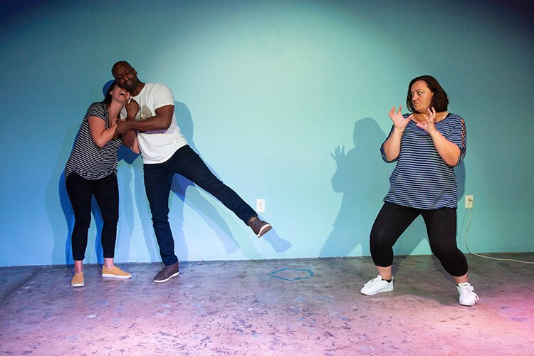 Alex Mixon, Julianna Narubin, and Matt Williams perform improv in Matheny's acting class.