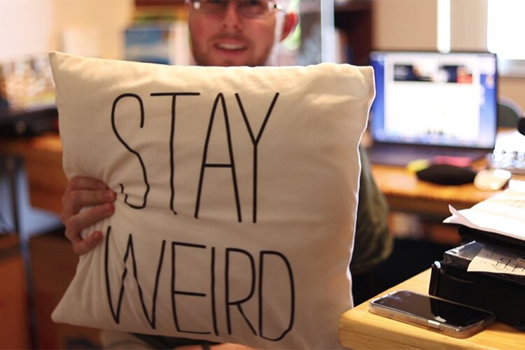 Richard Lloyd Westly Autumn shows off his pillow with his life motto.