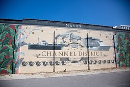 This mural by artist Meaghan Farrell Scalise on the Maven Market honors the Channel District area's history  and its present day boom.