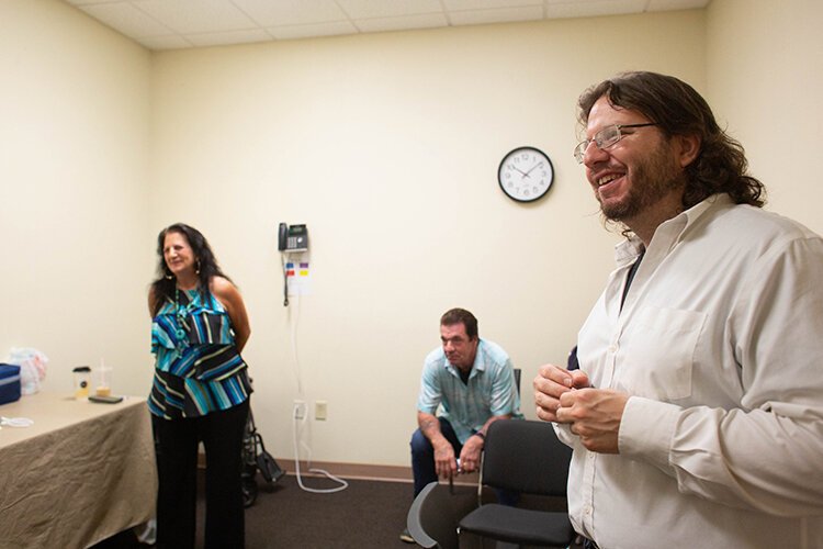 Diane and Robert Zweil, listen in as Matt Zweil, founder of Safe Exchange Tampa, leads a Narcan training class class for volunteers.