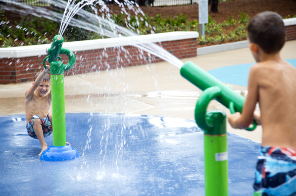 Drew and Nickolas Graham play at Water Works Park. - Julie Branaman