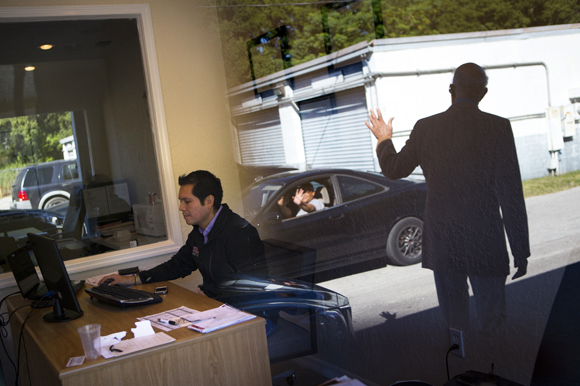 Julian Montenegro of Heavy Auto Parts (left) as THAP's James Hammond waves to a tenant.