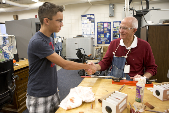 Sam Gardner thanks teacher Jon Wahnish for his help before leaving school Friday.  