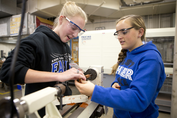 Hannah Edmonds (left) and Lauren Wonick-Cook work on designing a pen.  