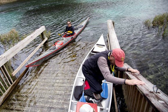  Florida Wildlife Corridor Expedition team member Mallory Dimmitt (left) lands her kayak after a "paddle mixer" on the Rainbow River. 